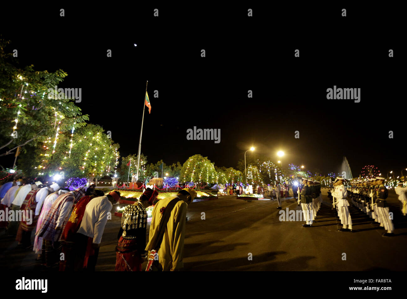 Nay Pyi Taw, Myanmar. 4th Jan, 2016. Myanmar military guard of honor and the representatives of Myanmar ethnics salute during a ceremony to celebrate Myanmar's 68th Independence Day in Nay Pyi Taw, Myanmar, Jan. 4, 2016. Credit:  U Aung/Xinhua/Alamy Live News Stock Photo