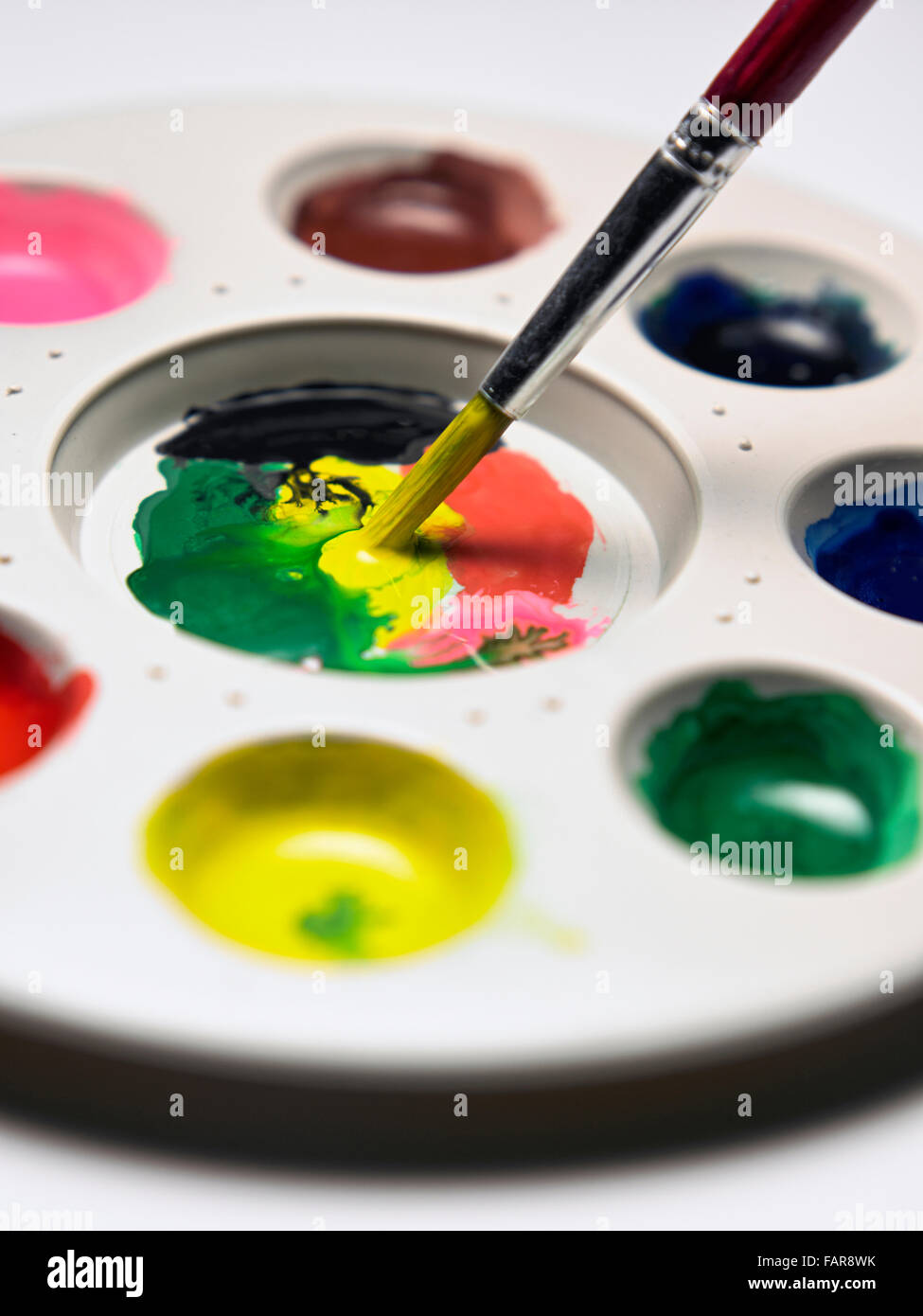 Painting mixing palette art colors and brush Stock Photo - Alamy