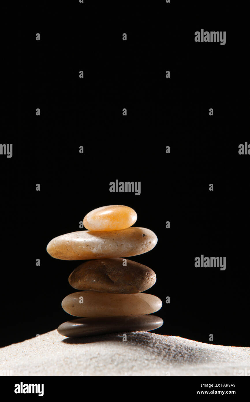 Stack of stones on the sand Stock Photo - Alamy