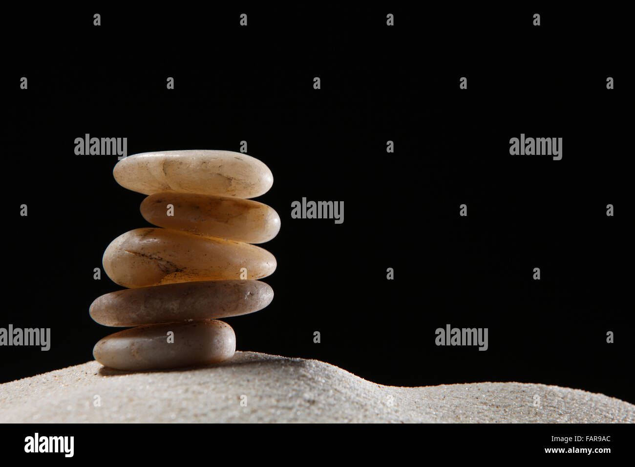 Stack of stones on the sand Stock Photo - Alamy