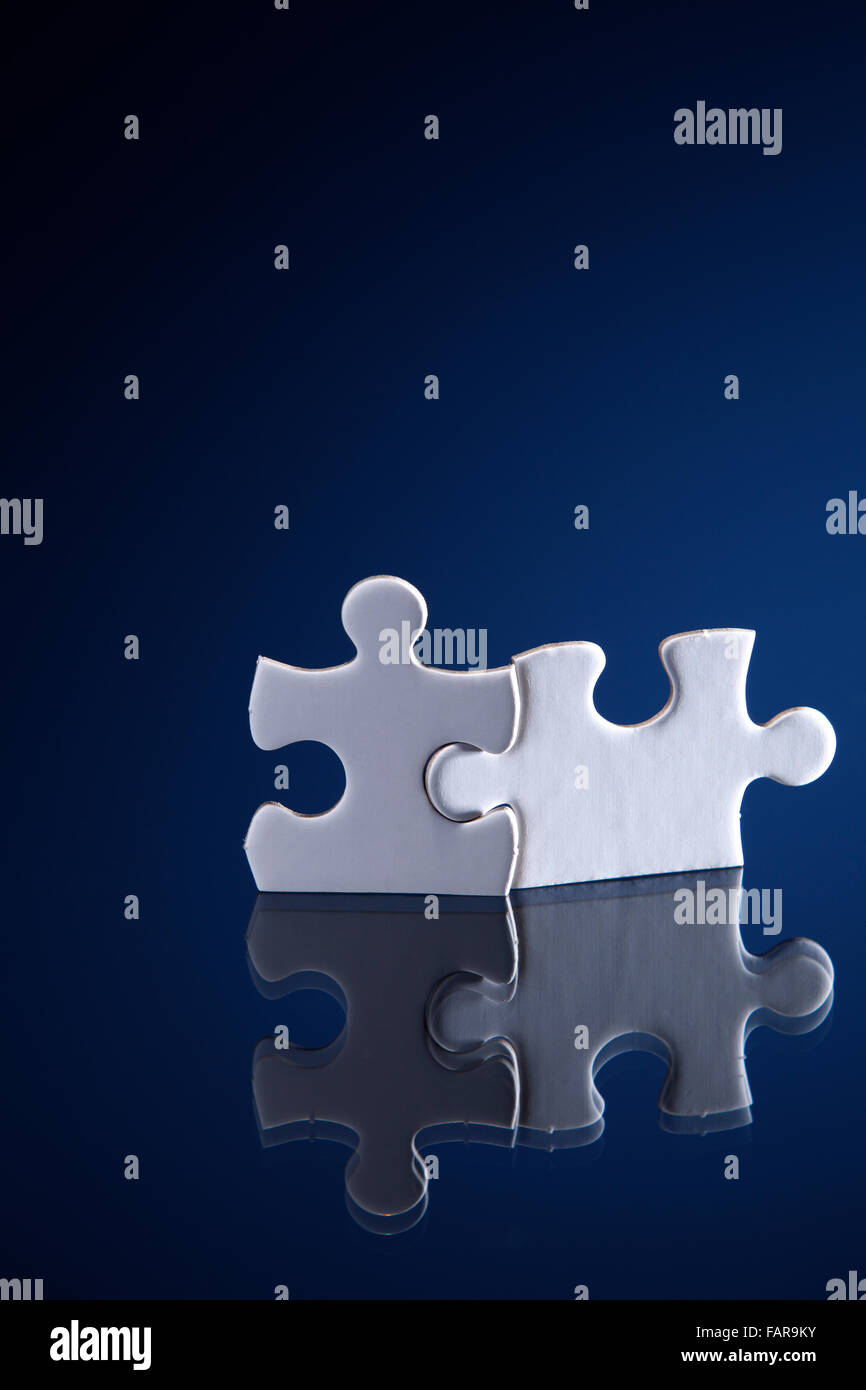 Bonding of two puzzle pieces Stock Photo - Alamy