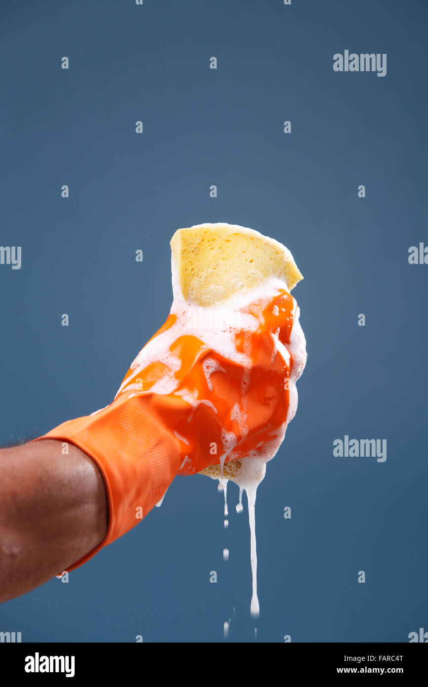 Squeezing wet sponge hi-res stock photography and images - Alamy