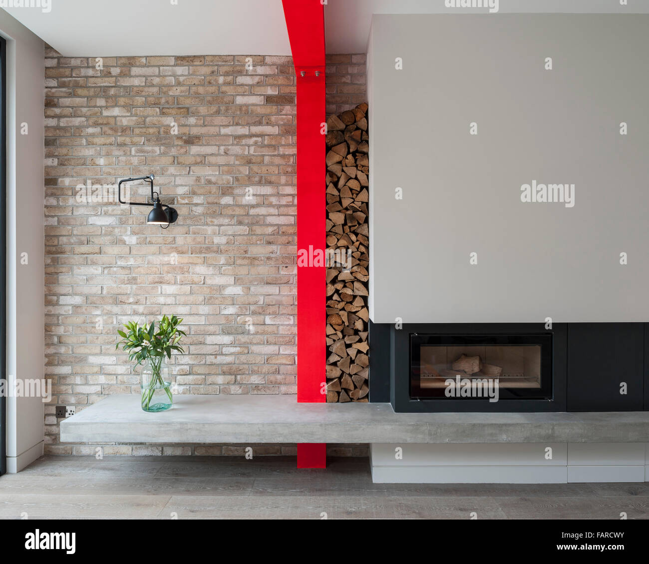 Elevation of fireplace and concrete plinth with feature steel column