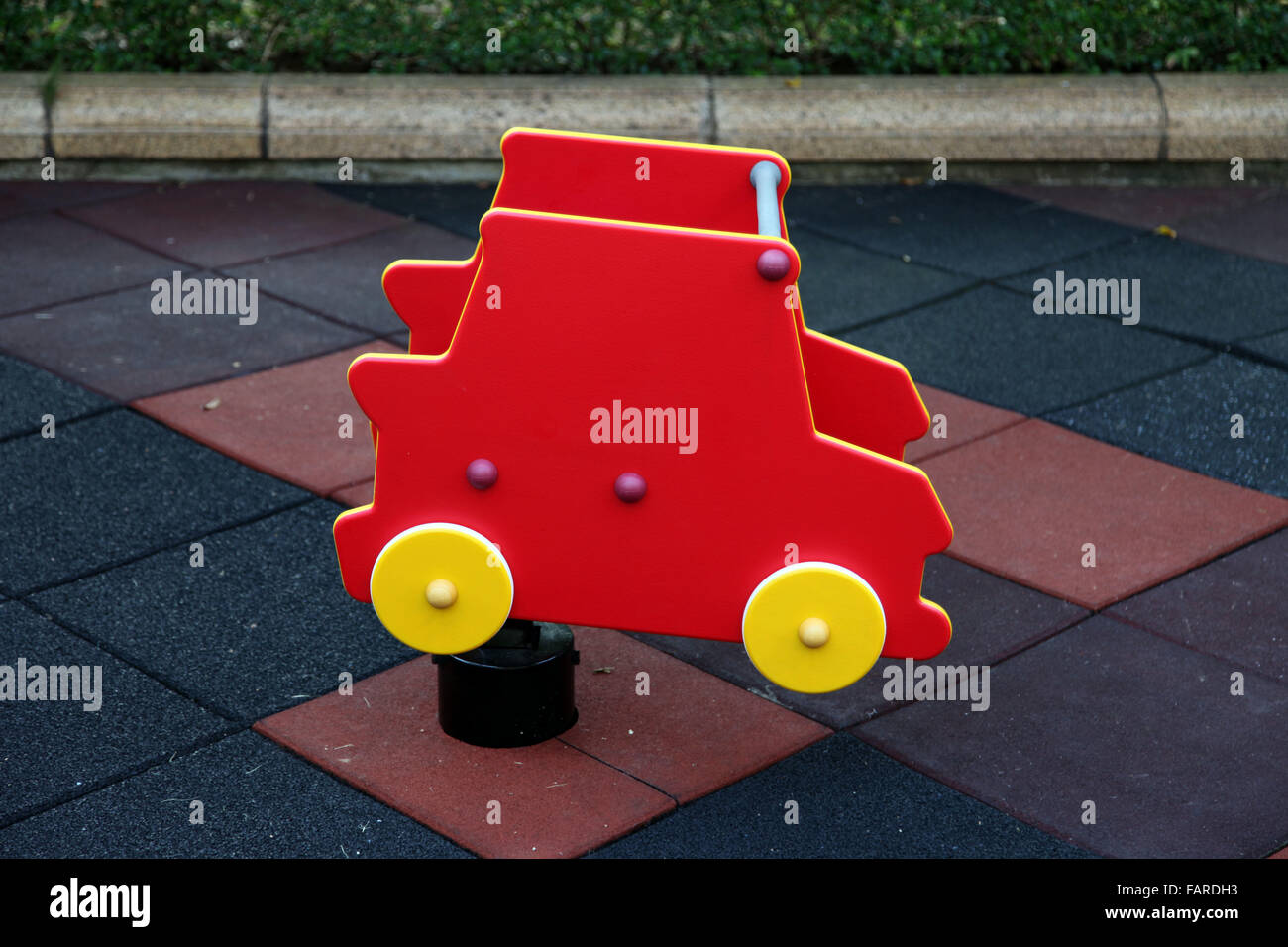 It's a photo of a swing car for kid on a outdoor playground Stock Photo