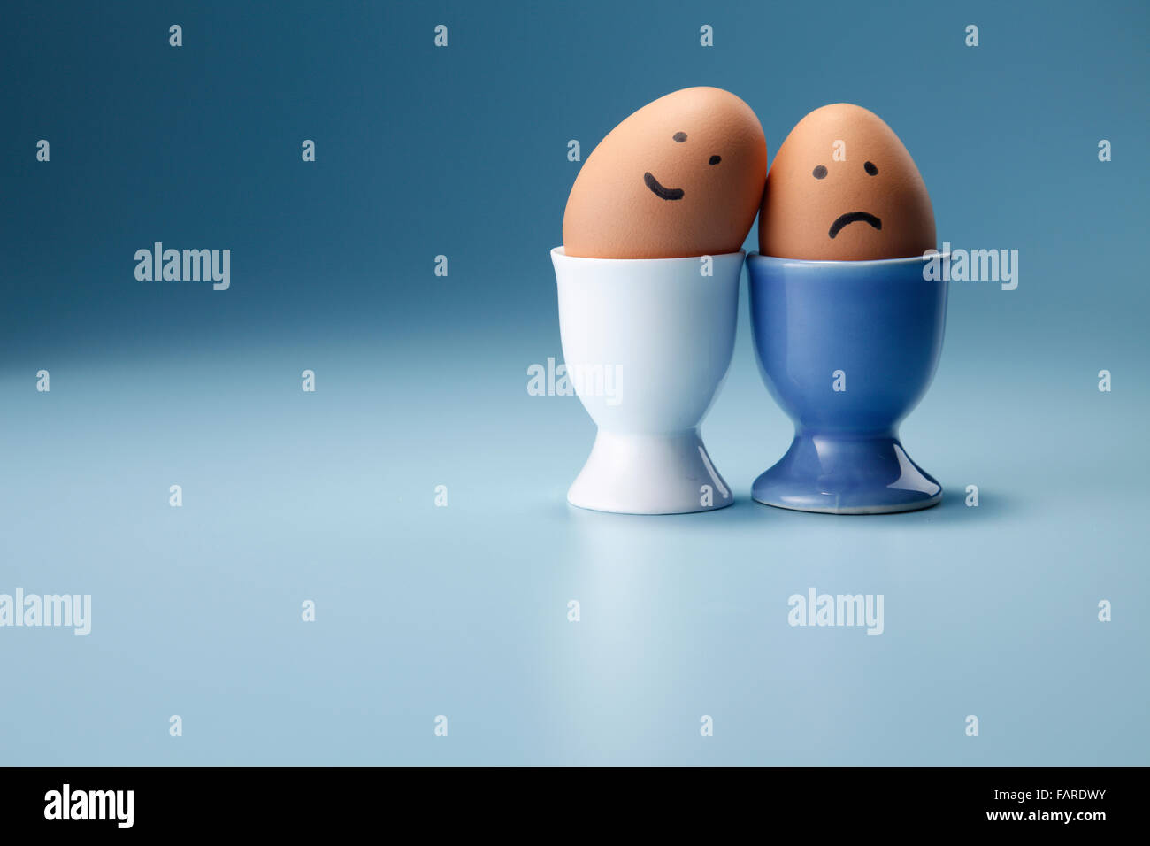 egg with funny face on the egg cup Stock Photo