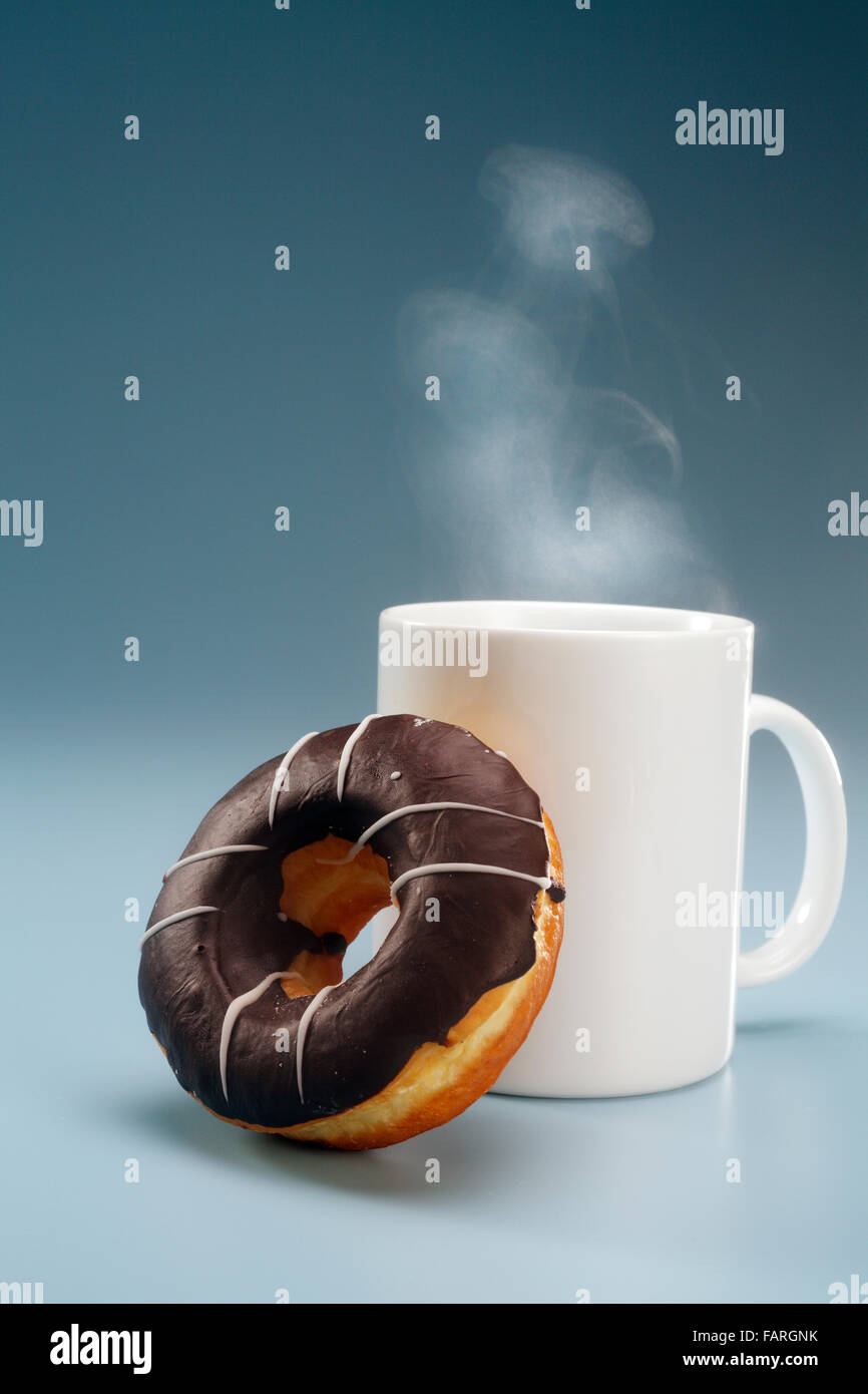 coffee and donut for breakfast Stock Photo Alamy