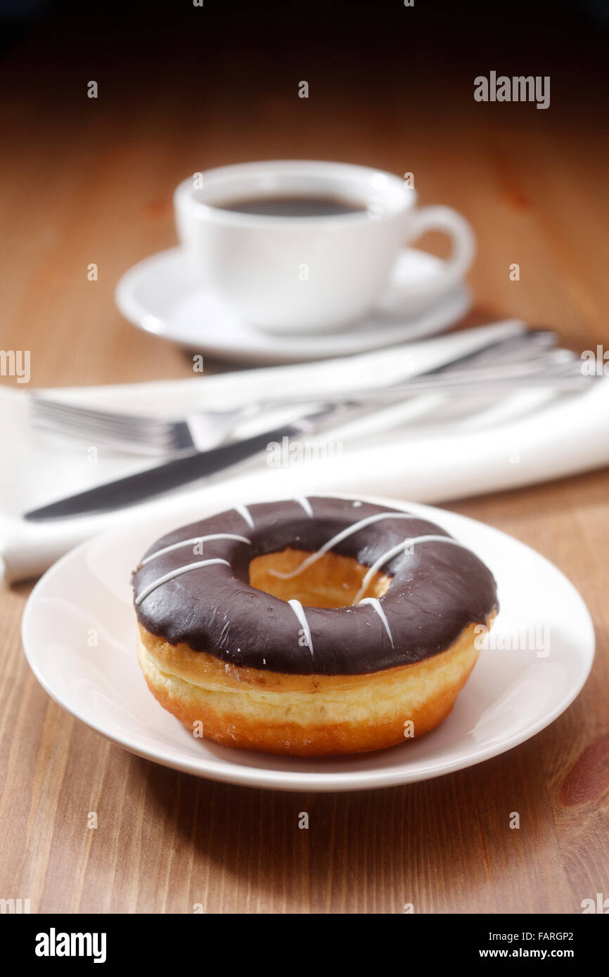coffee and donut for breakfast Stock Photo Alamy