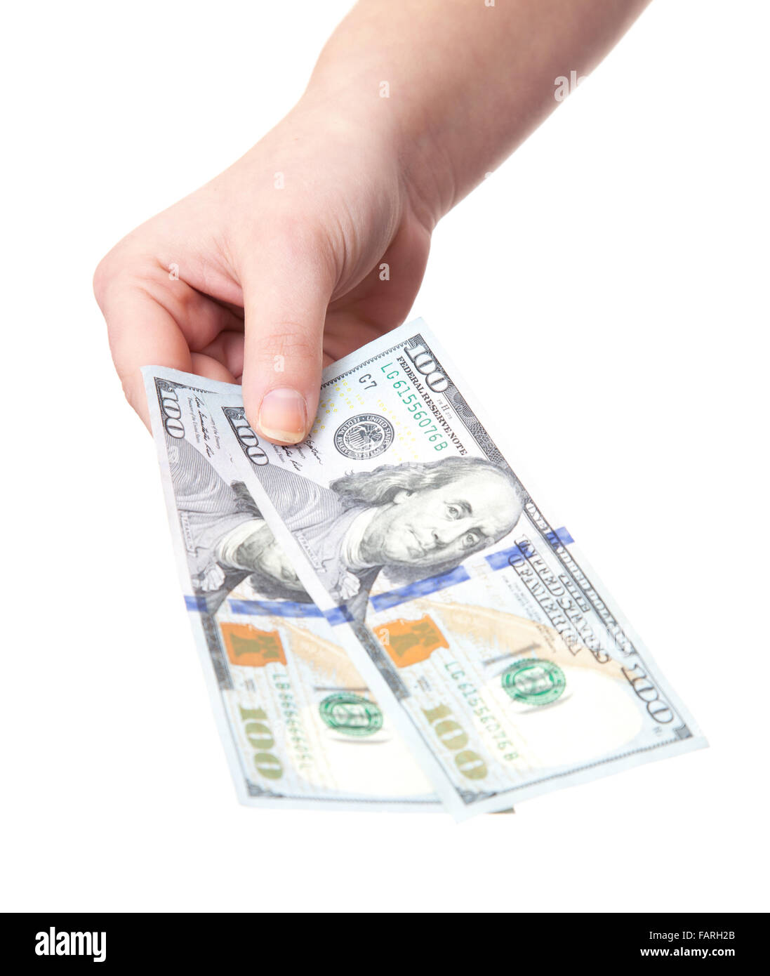 Hand holding hundred dollar notes. All on white background. Stock Photo