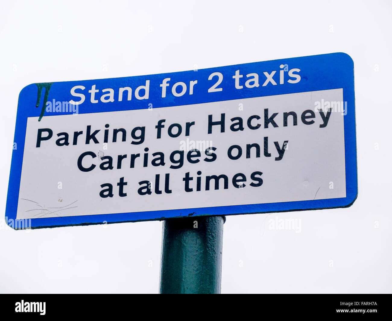 Taxi Stand sign two taxis Parking for Hackney Carriages only at all times Stock Photo