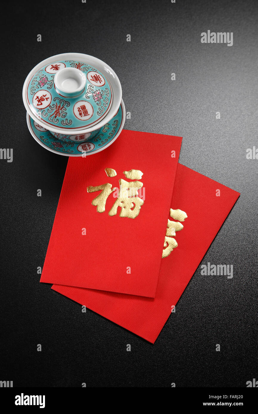 stock image of tea cup with ang pao Stock Photo Alamy