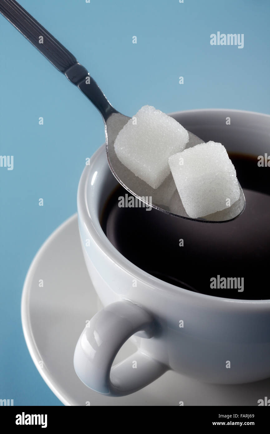 stock image of adding sugar to coffee Stock Photo Alamy
