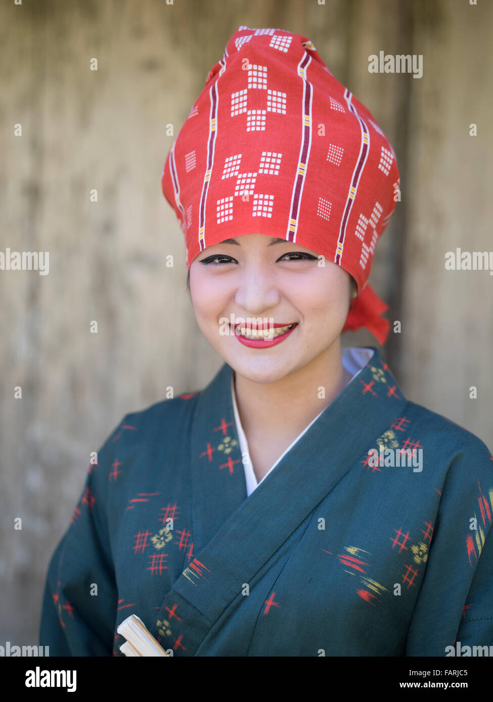 Okinawan woman in traditional costume, Ryukyu Mura, Okinawa, Japan Stock Photo