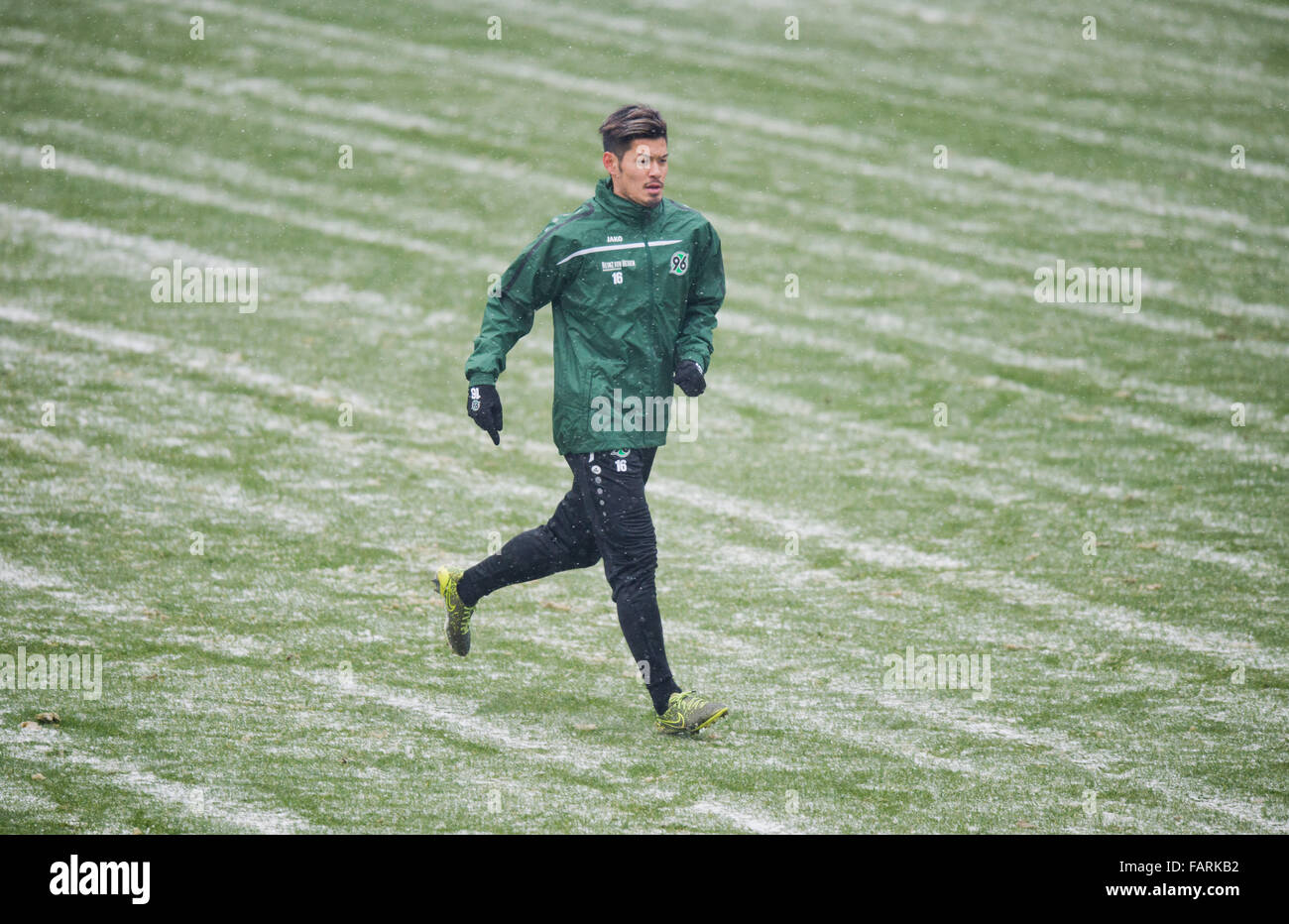 Hanover, Germany. 04th Jan, 2016. New entry Hotaru Yamaguchi of German Bundesliga soccer club Hannover 96 runs across the pitch at the begining of the new year's first training session at HDI Arena in Hanover, Germany, 04 January 2016. Photo: Julian Stratenschulte/dpa/Alamy Live News Stock Photo