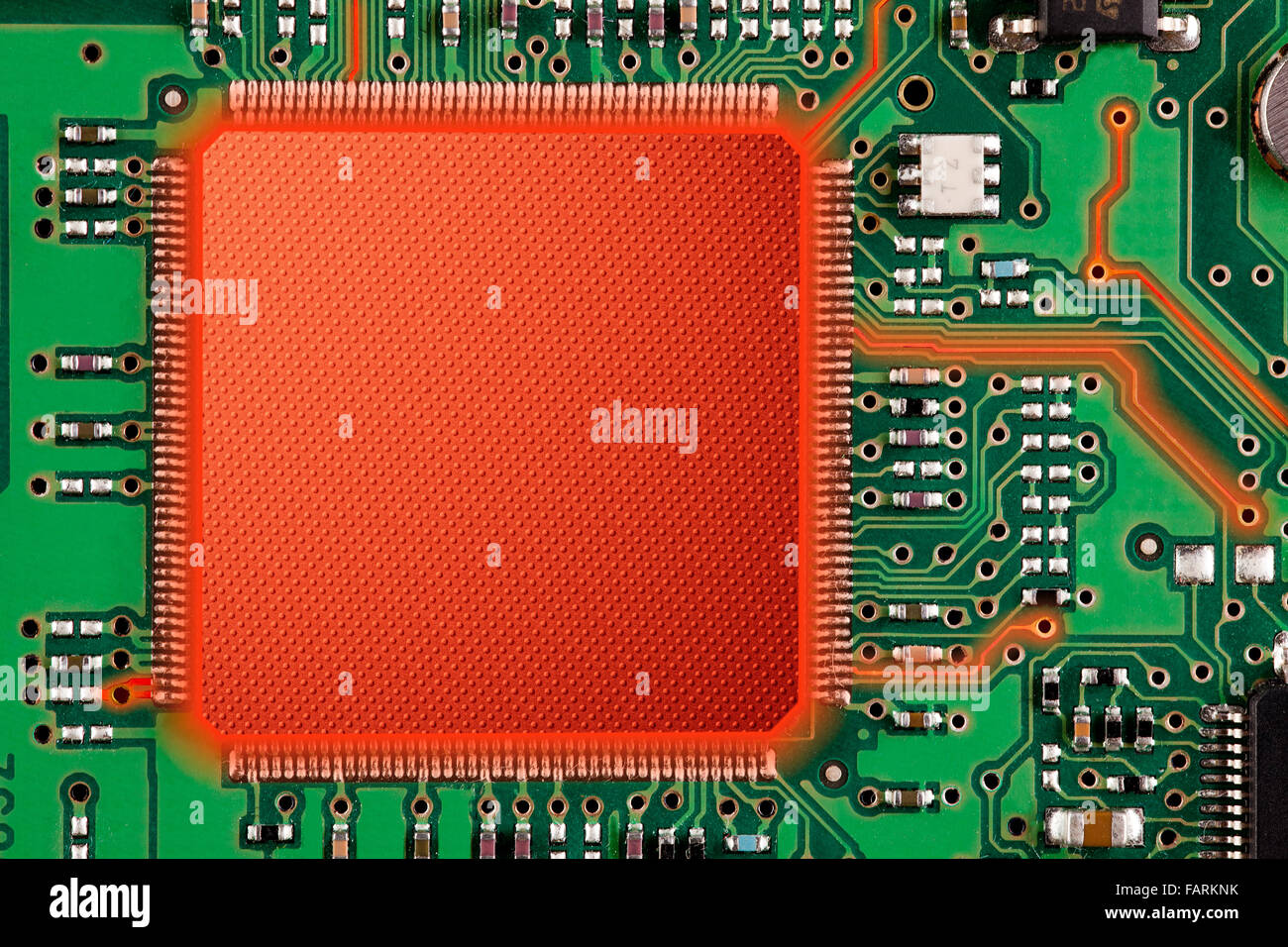 green and red printed circuit board or computer technology background Stock Photo