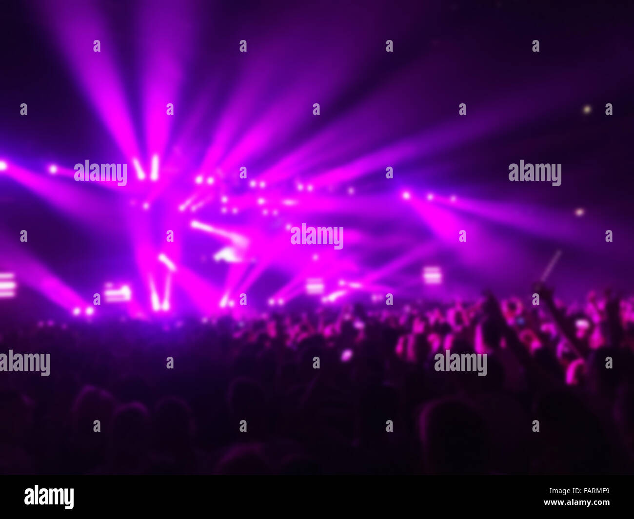 Blur shot of crowd on music concert with lights effects Stock Photo