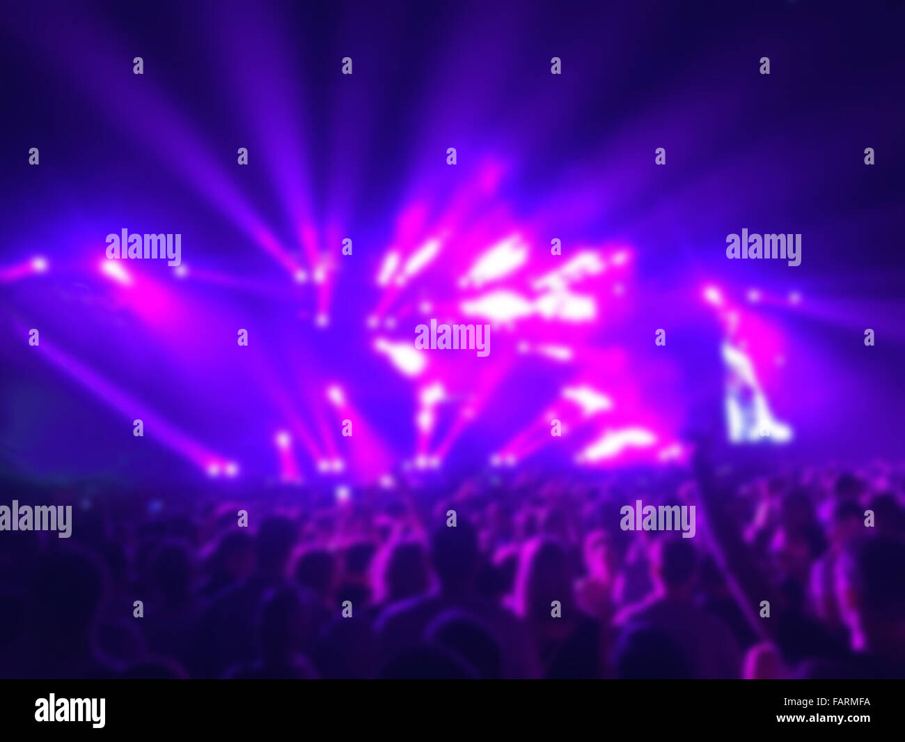 Blur shot of crowd on music concert with lights effects Stock Photo