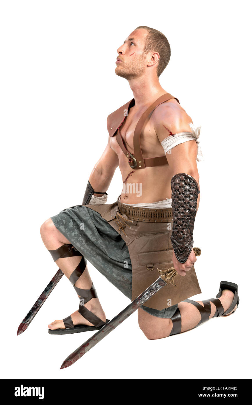 Gladiator posing isolated in a white background Stock Photo - Alamy