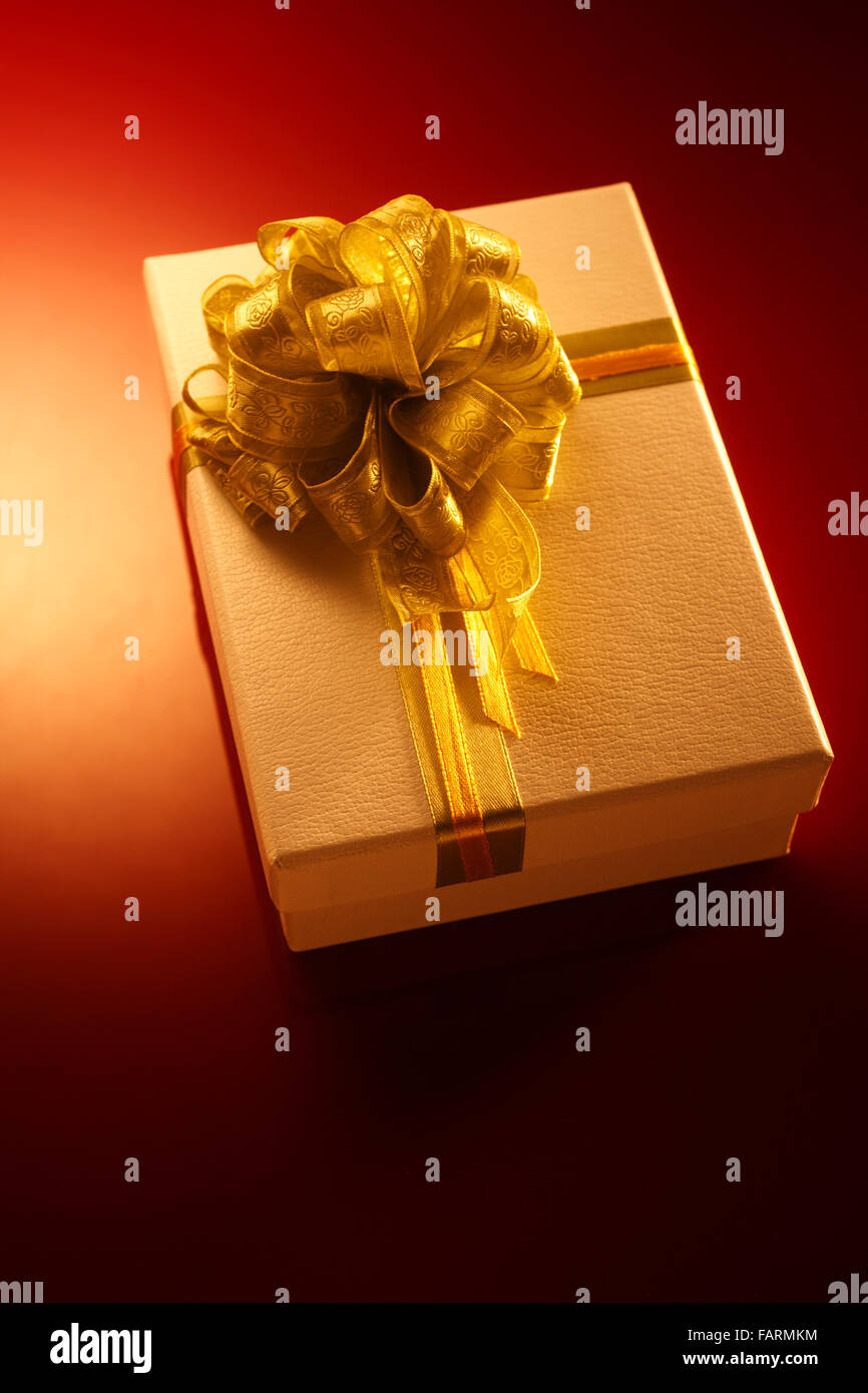 Isolated close gift box with gold ribbon Stock Photo Alamy