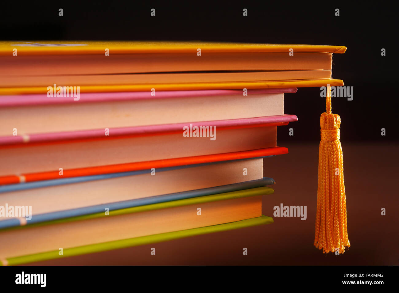 stack of books colourful hard cover with hanging tassle Stock Photo