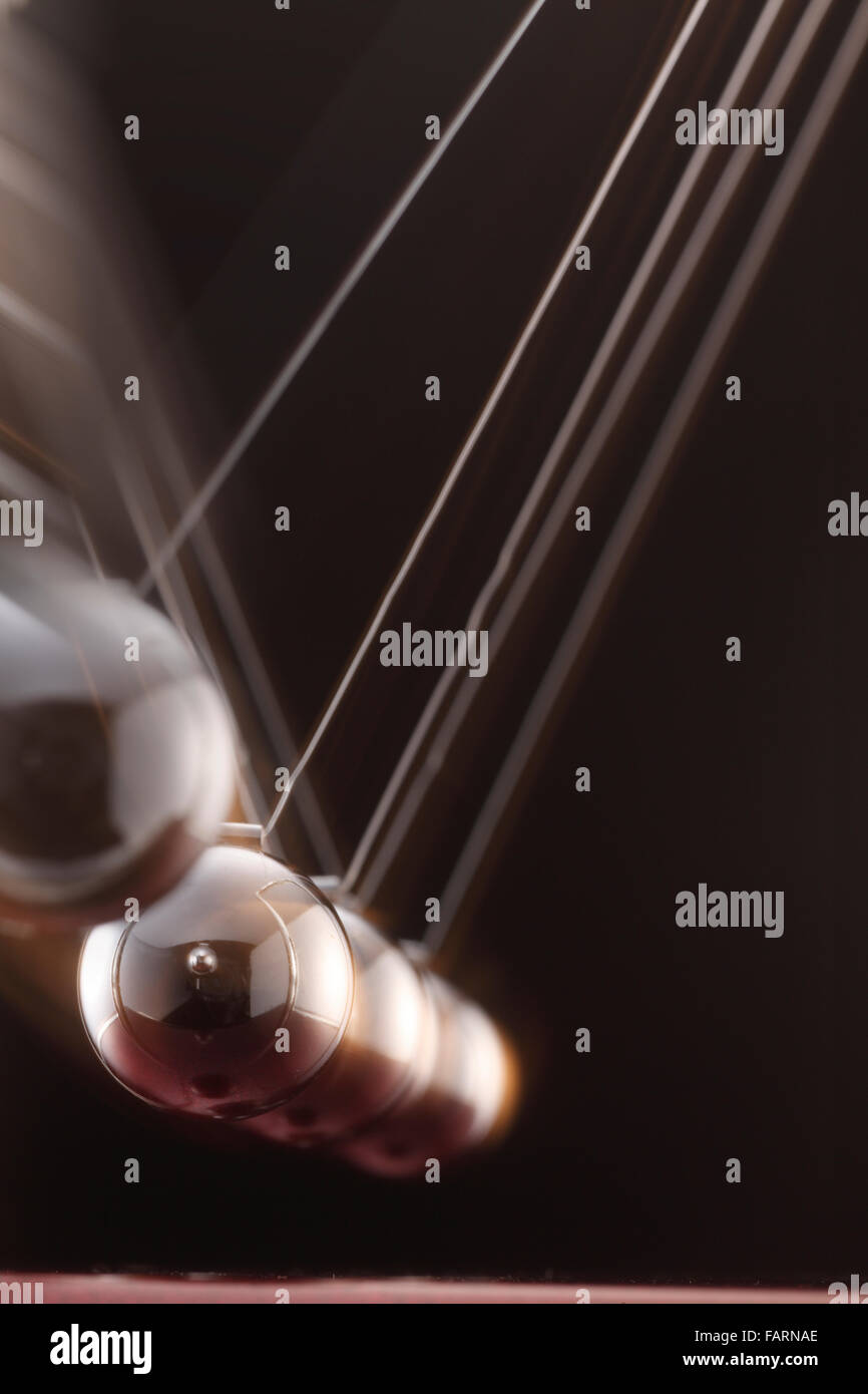 A simple pendulum swinging across Stock Photo Alamy