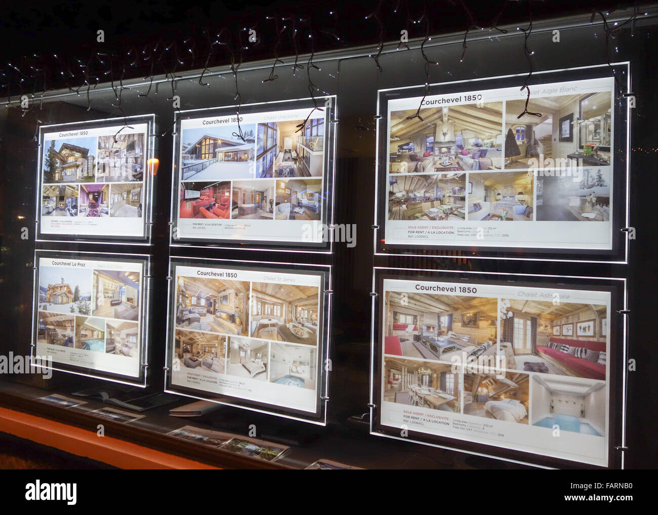 John Taylor luxury property real estate agent window display in the