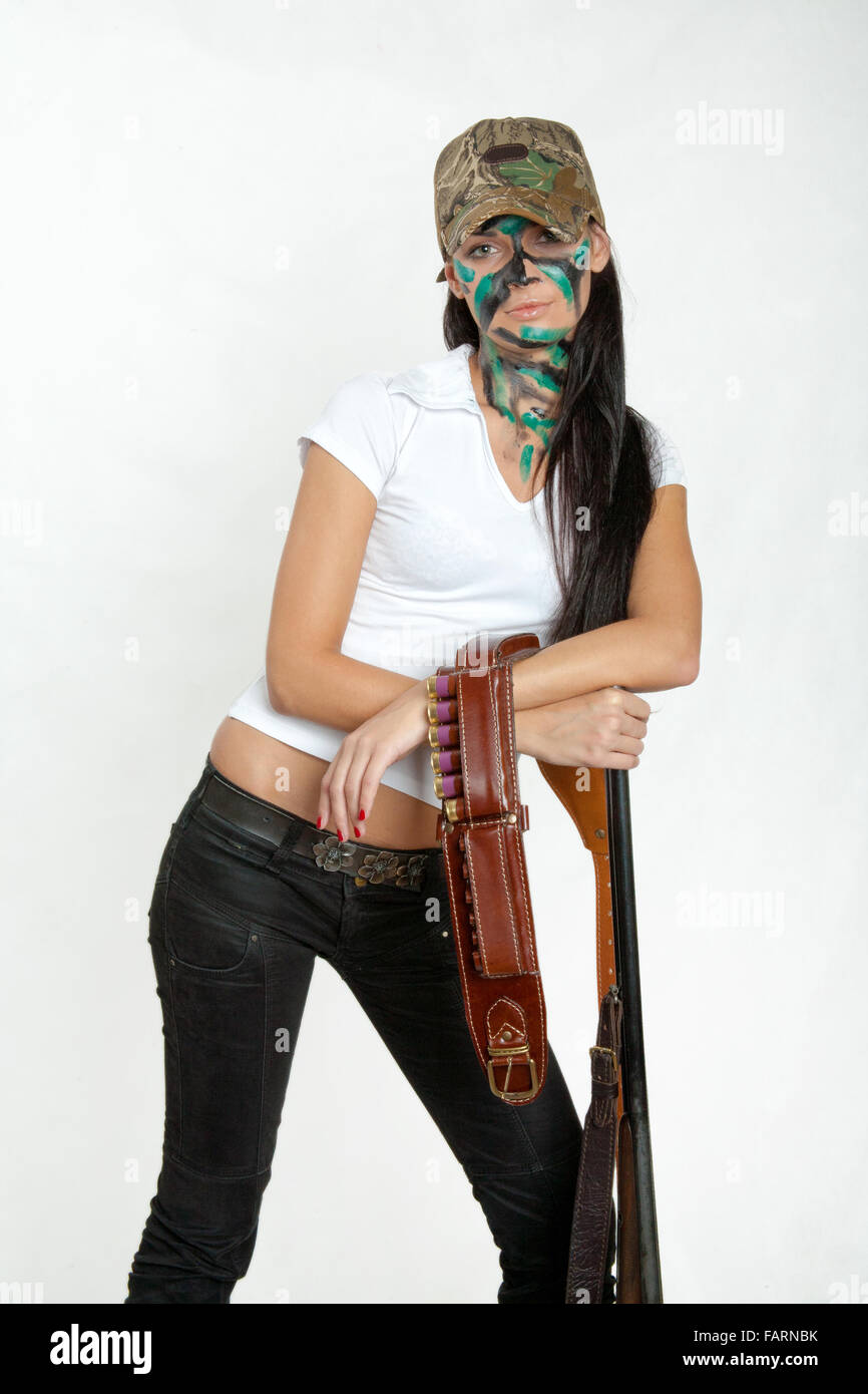 a young girl and gun Stock Photo