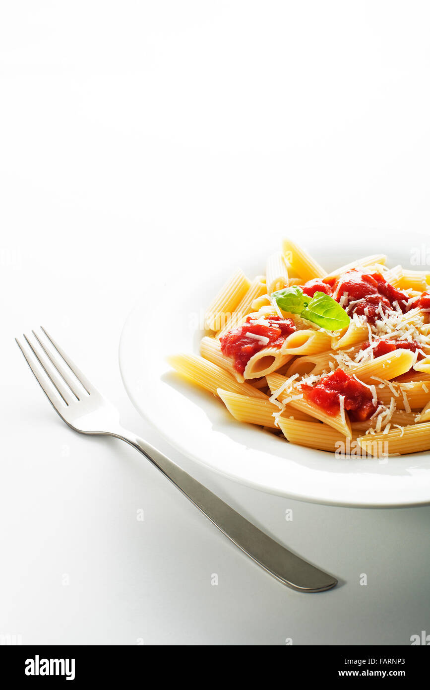 Plate of penne pasta with tomato sauce and parmesan cheese. Stock Photo