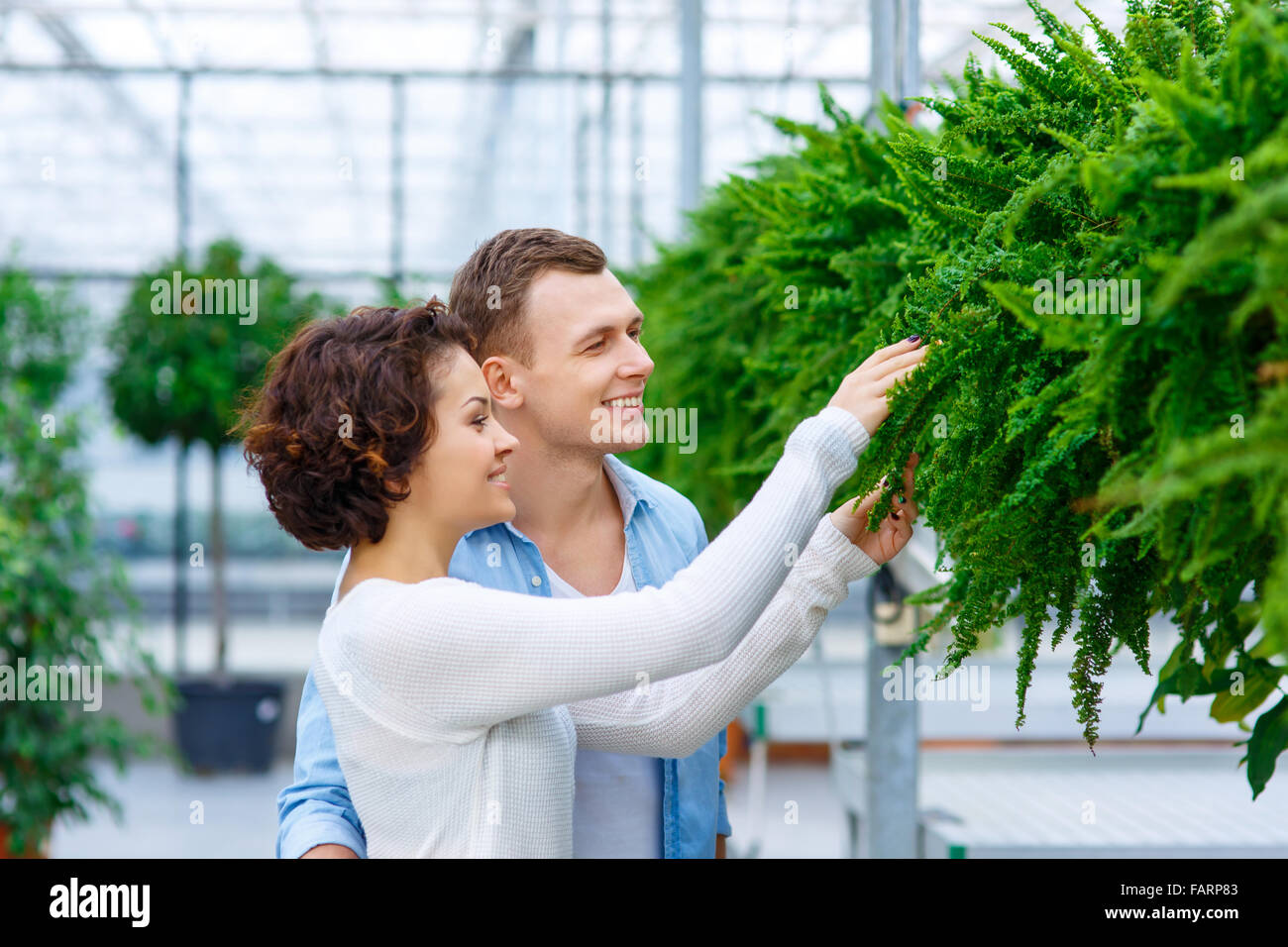 Young couple choosing flowers Stock Photo - Alamy