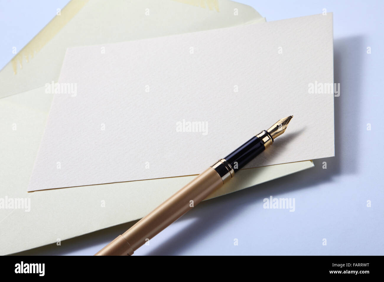 pastel yellow envelope letter and pen Stock Photo Alamy