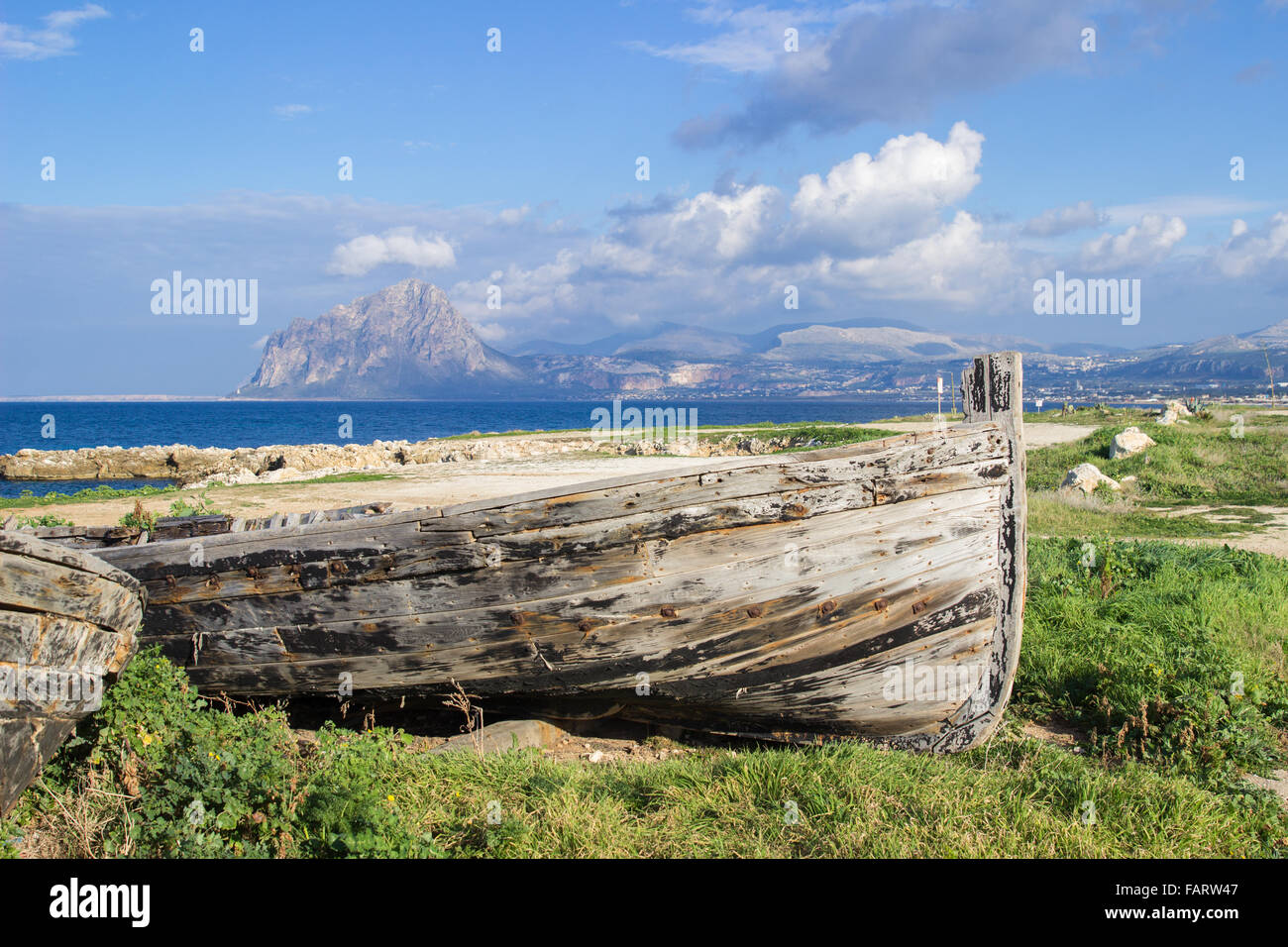 row boats sea mountain landscape coast old wooden clouds Stock Photo