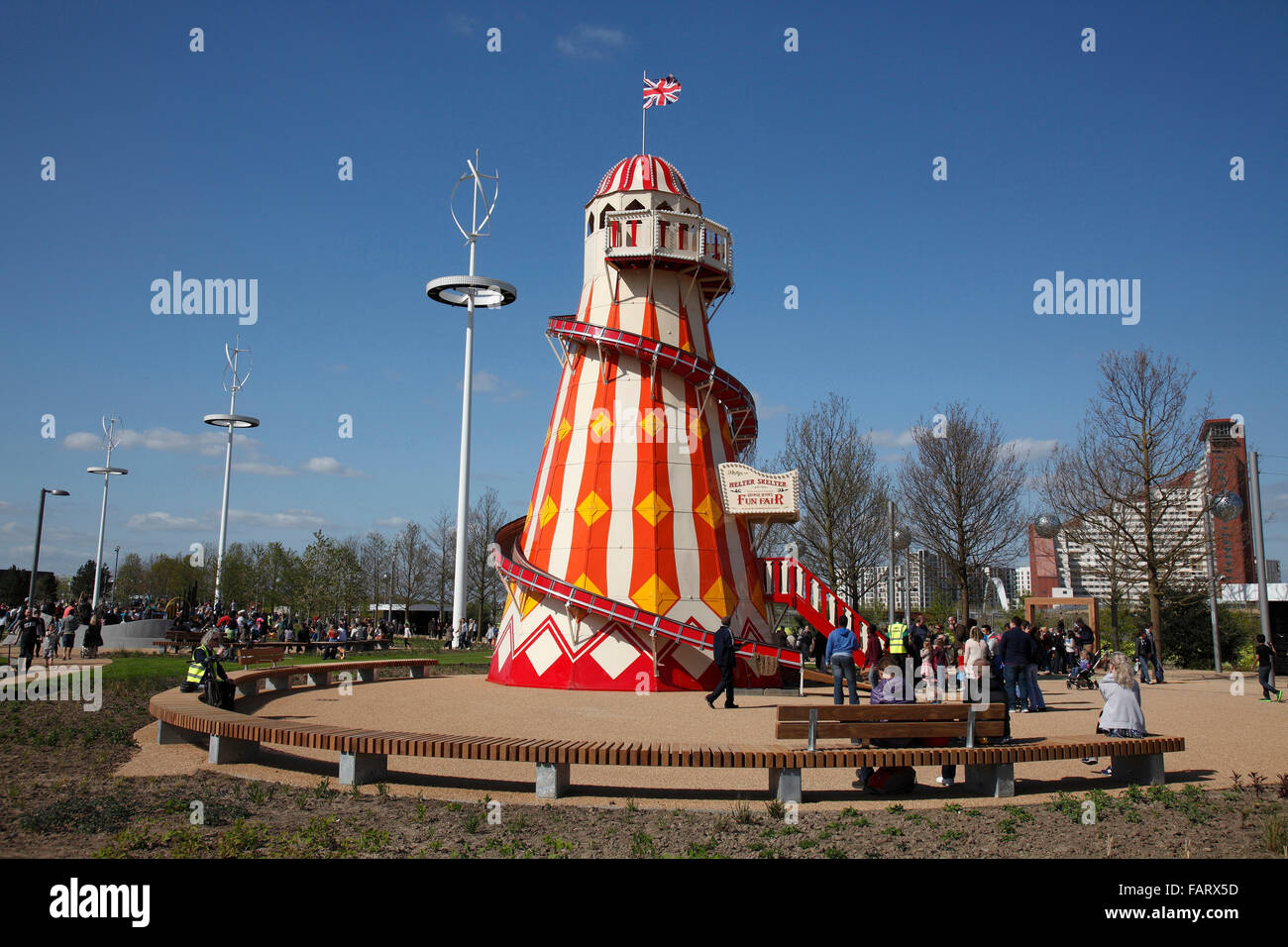 Old fashioned helter skelter with wind turbines. Stock Photo