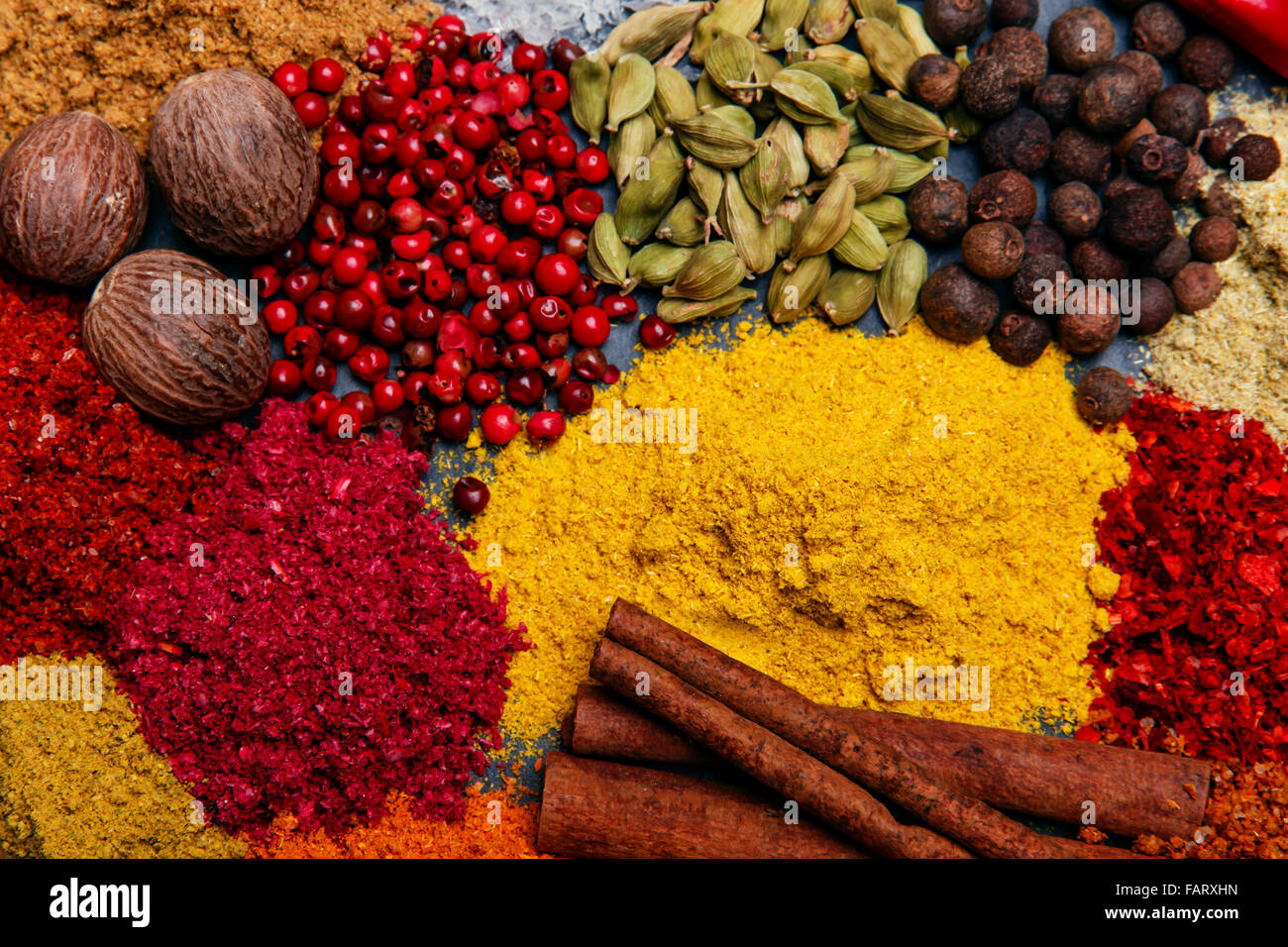 assortment of spices seasoning on a black stone Stock Photo Alamy
