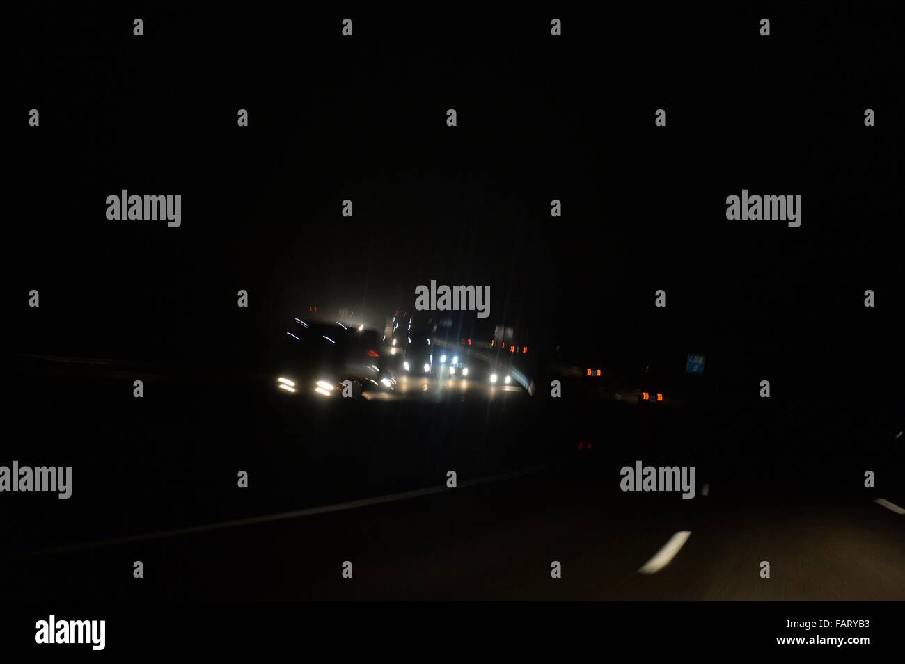 Cars on a german Highway at night, Germany, 16. December 2015. Photo: Frank May Stock Photo