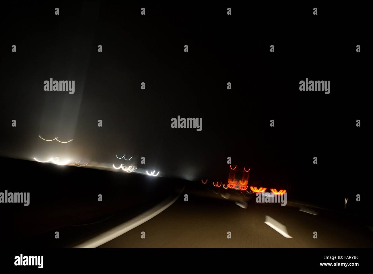 Cars on a german Highway at night, Germany, 16. December 2015. Photo: Frank May Stock Photo