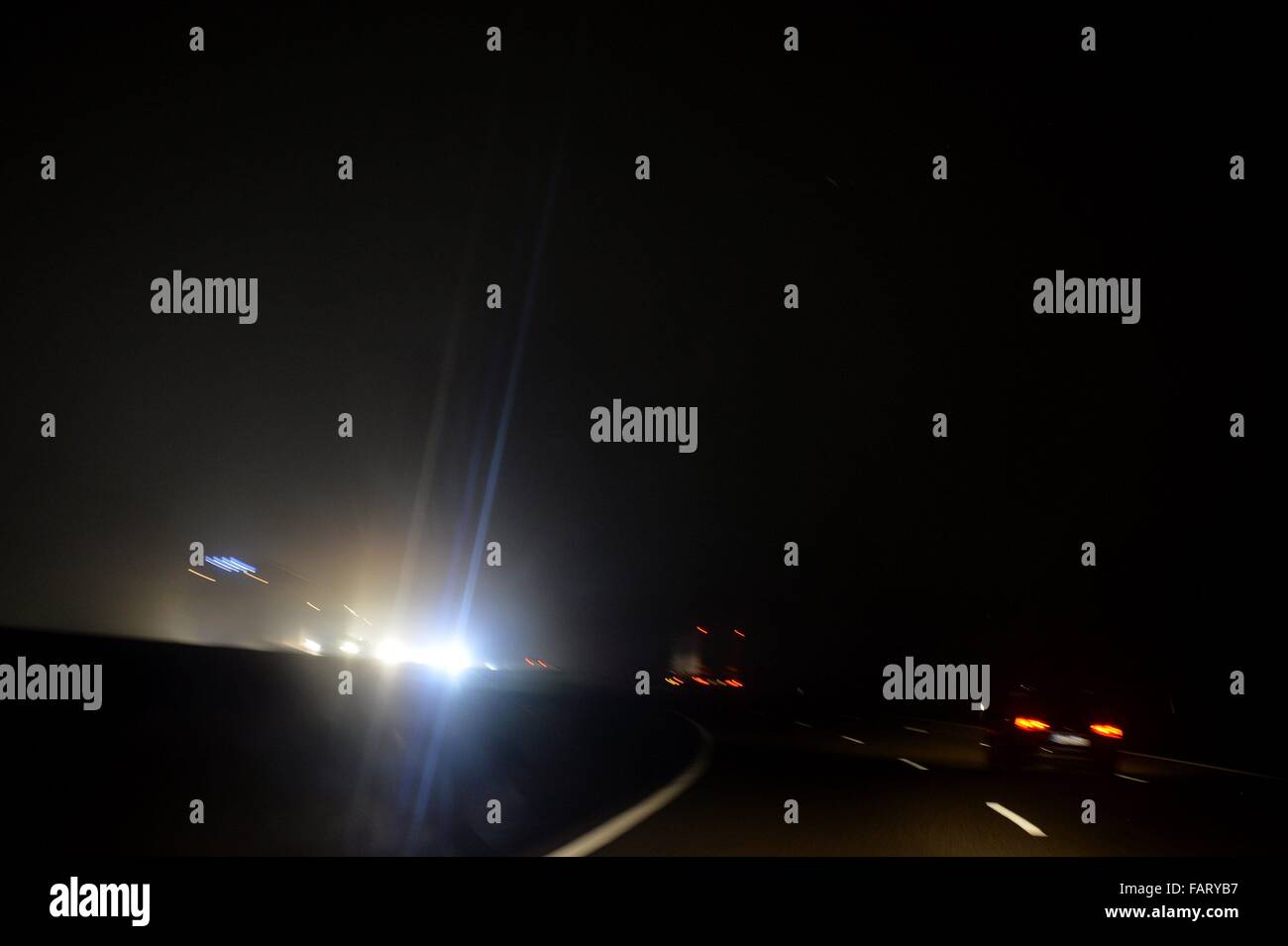 Cars on a german Highway at night, Germany, 16. December 2015. Photo: Frank May Stock Photo