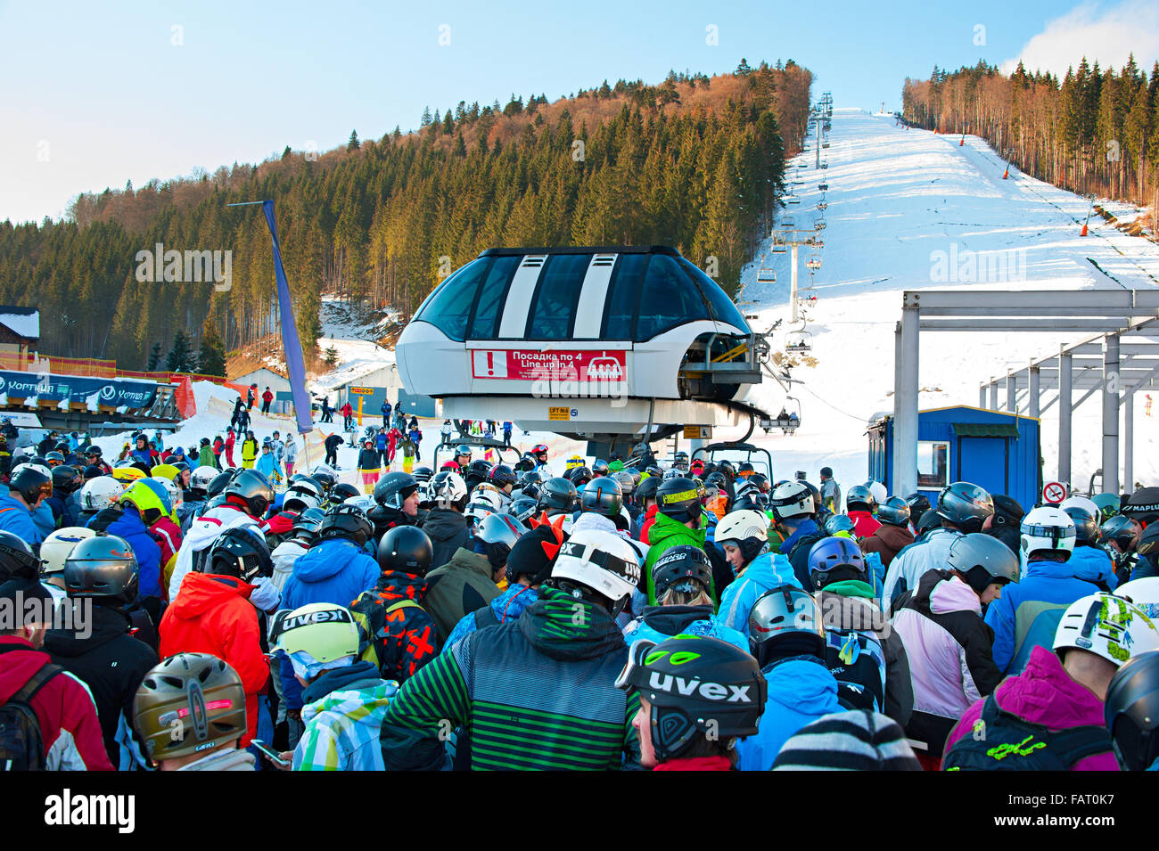 Crowd in queue for a ski lift in Bukovel. Bukovel is the most popular ski  resort in Ukraine Stock Photo - Alamy