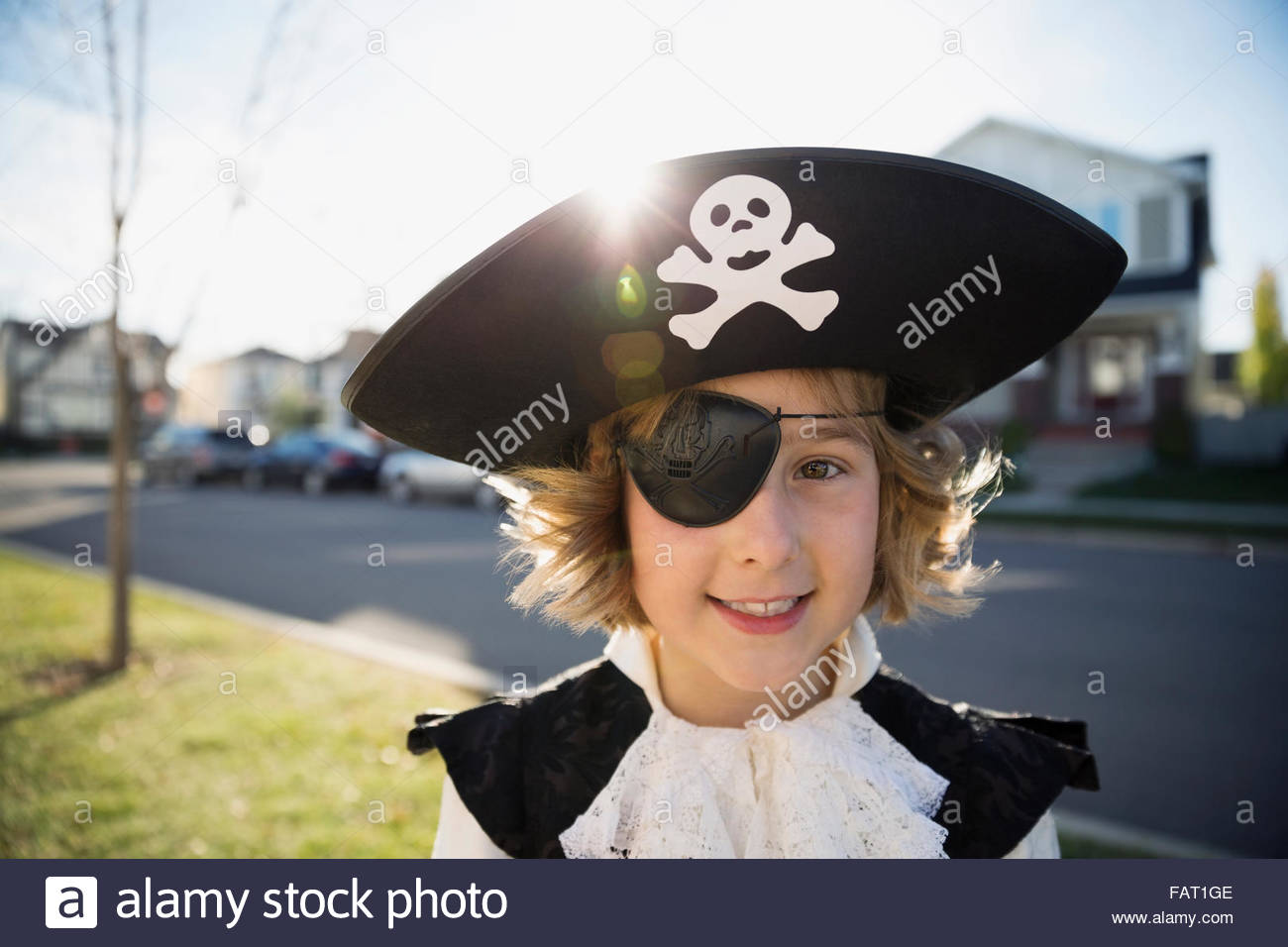 Portrait smiling girl Halloween pirate costume eye patch Stock Photo
