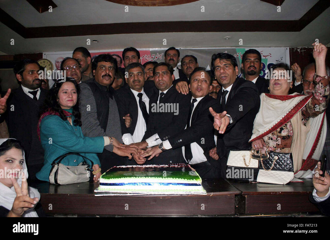 Members of Peoples Lawyers Forum (PLF) cut cake on the occasion of 88th Birthday Day Anniversary of PPP Leader, Late Zulfiqar Ali Bhutto, during a ceremony held in Lahore on Monday, January 04, 2016. Stock Photo