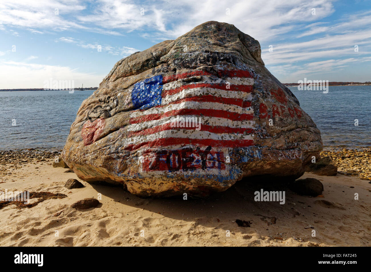The American flag painted on a rock as a makeshift memorial to the 9-11 attacks, on Shelter island, New York. Stock Photo
