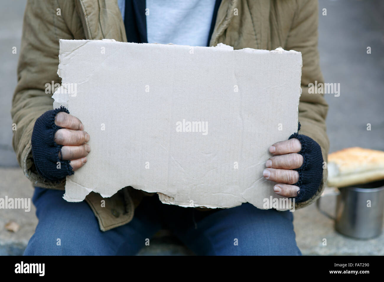 Homeless Man Holding A Cardboard Sign Stock Photo Alamy