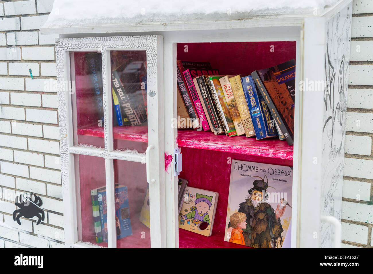 Little Free Library is a street-level book deposit where everyone can take or give a book, free of charge. Stock Photo