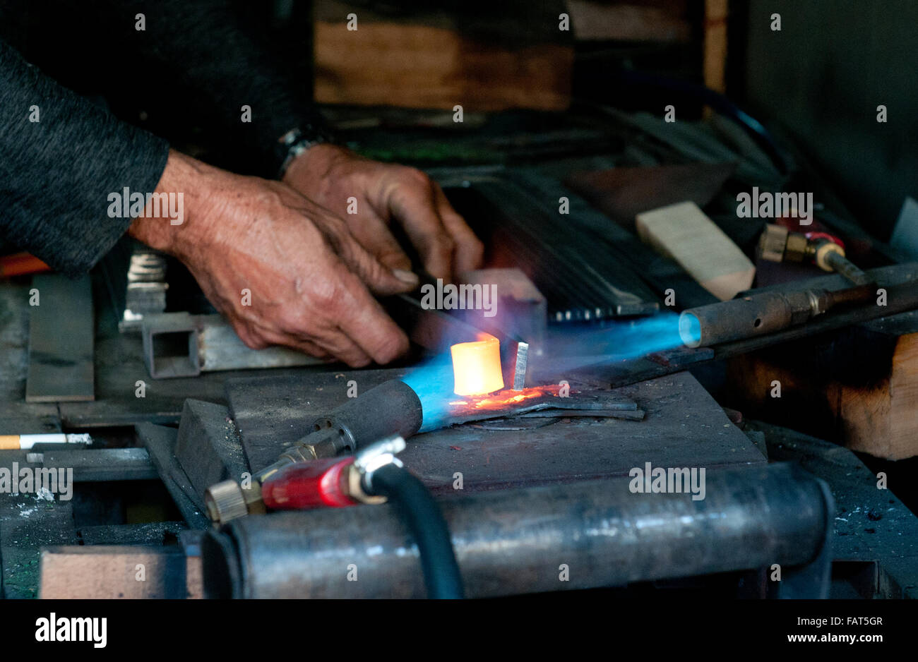 Blacksmith melting iron with oxygen flames Stock Photo Alamy