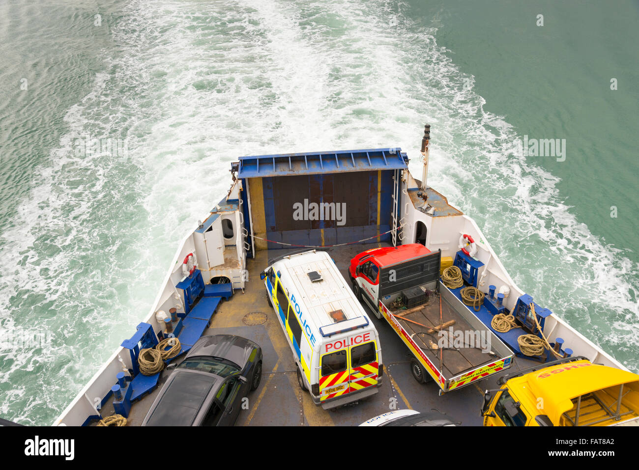 Vans and vehicles on the back of a car ferry viewed from above whilst at  sea Stock Photo - Alamy