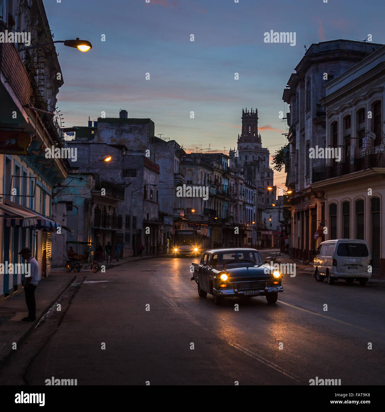 The darkness begins to lift as the sun rises above the rugged streets of Centro Havana one morning - Cuba. Stock Photo