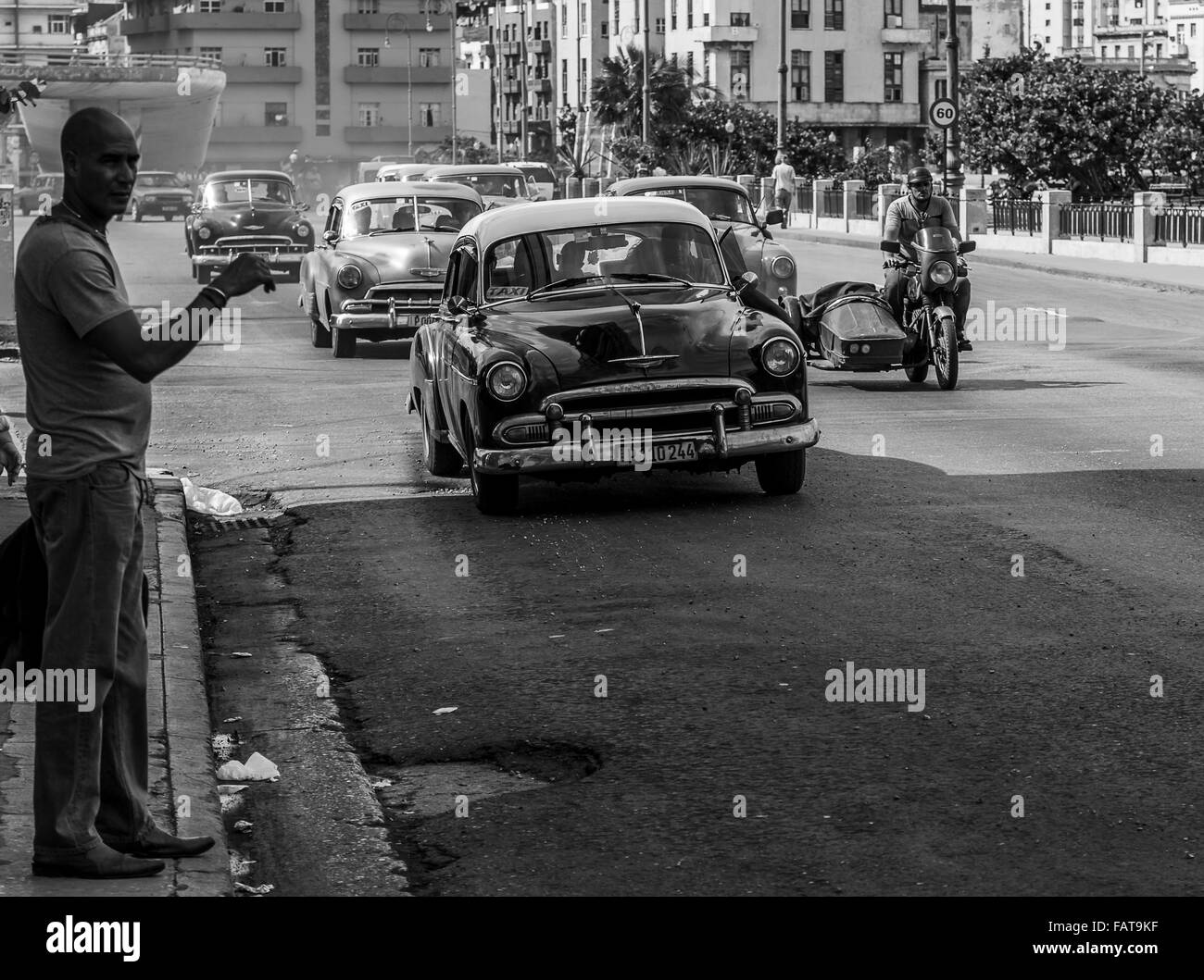 Busy street in Centro Havana captured in monochrome. Stock Photo