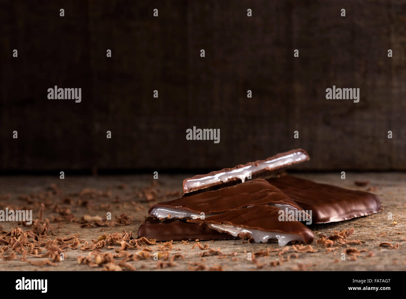 Stack of After Dinner mints chocolate over rustic background Stock Photo