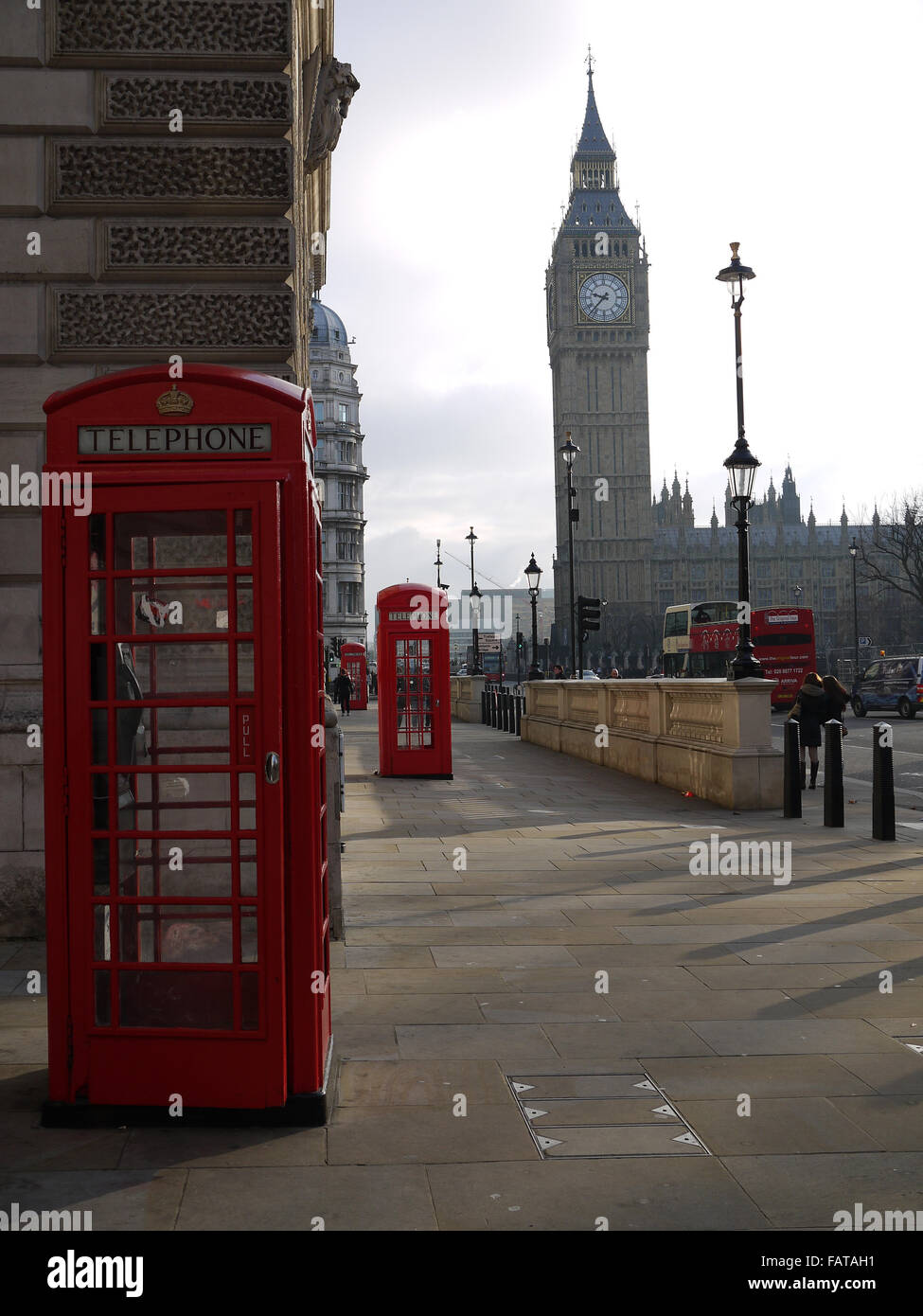 Telephone boxes in a row looking towards the House of Parliament, London, England Stock Photo