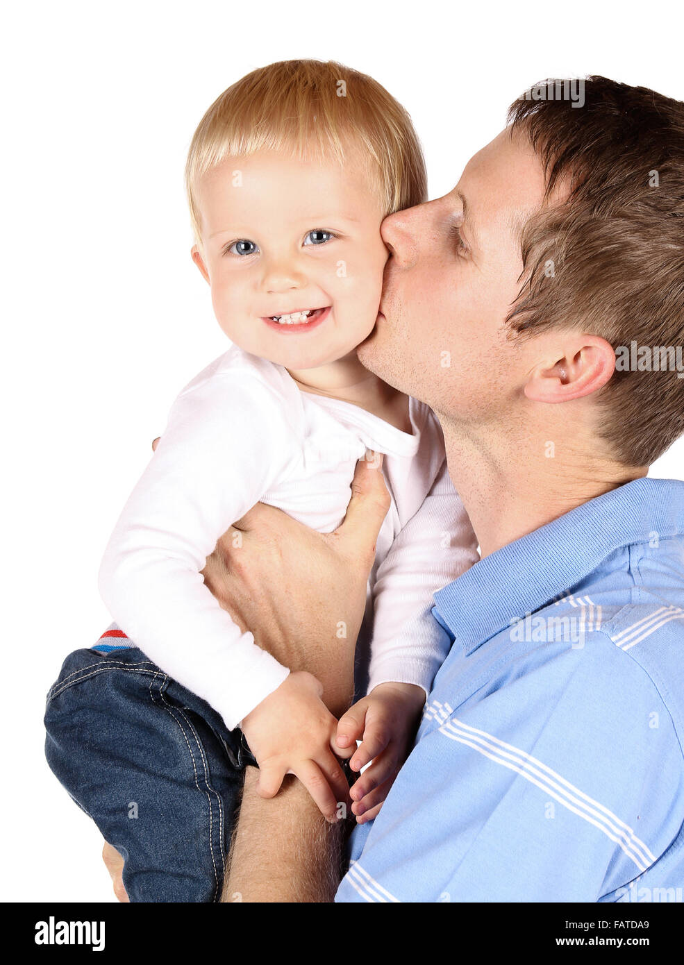 Happy caucasian dad holding and kissing his baby boy. Image is isolated on a white background. Stock Photo