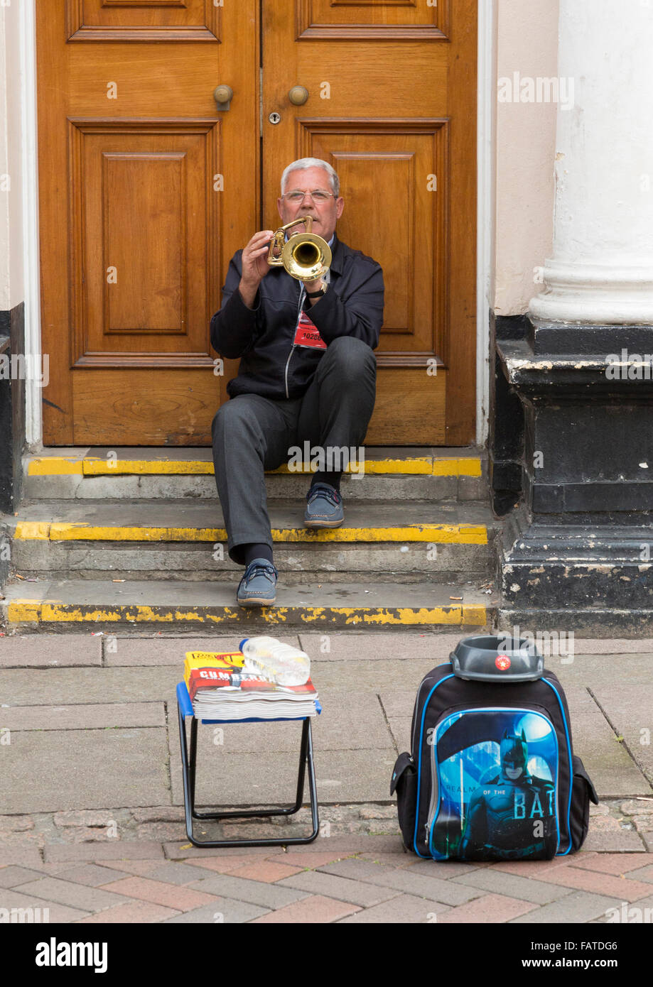 male playing a trumpet in the street Stock Photo