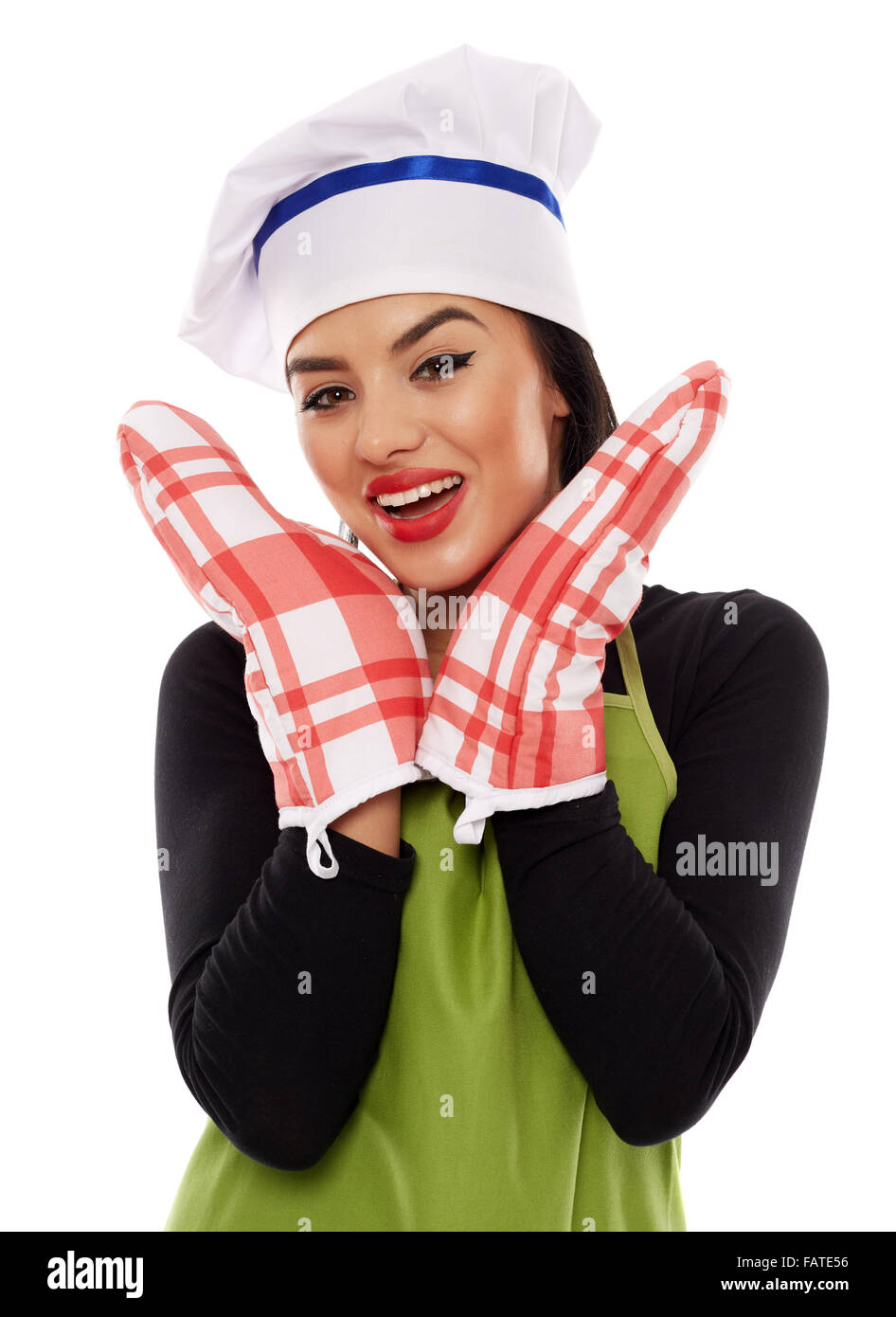Beautiful latino cook wearing a pair of oven gloves, isolated on white background Stock Photo